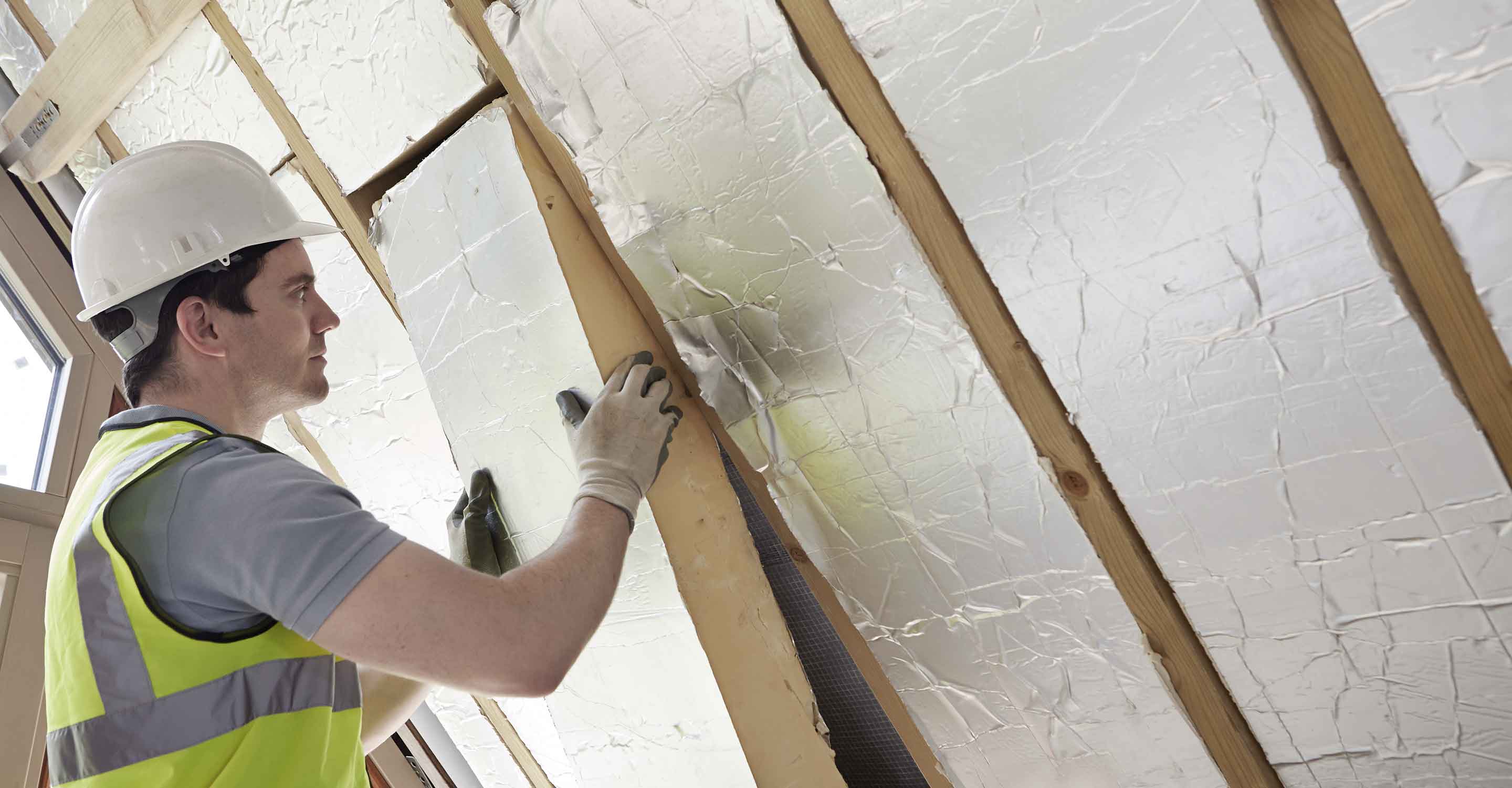 man fixing a wall