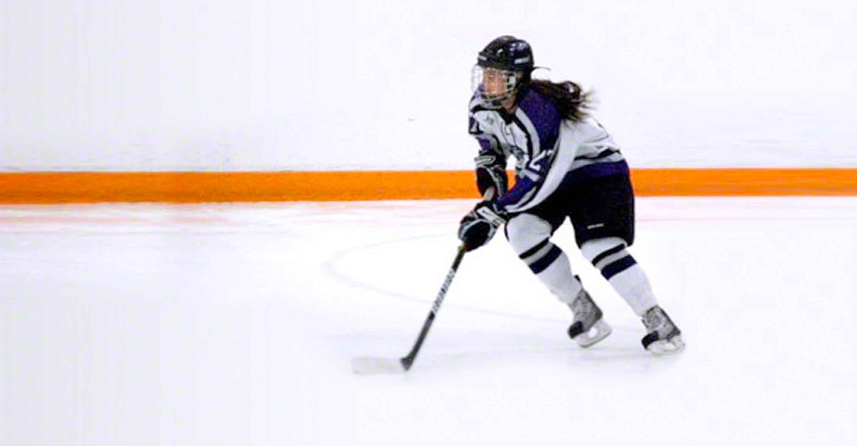 girl playing ice hockey