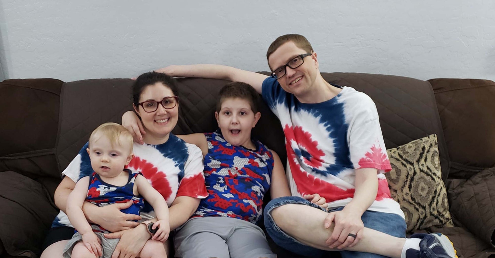 Aaron Carroll and family sitting on couch