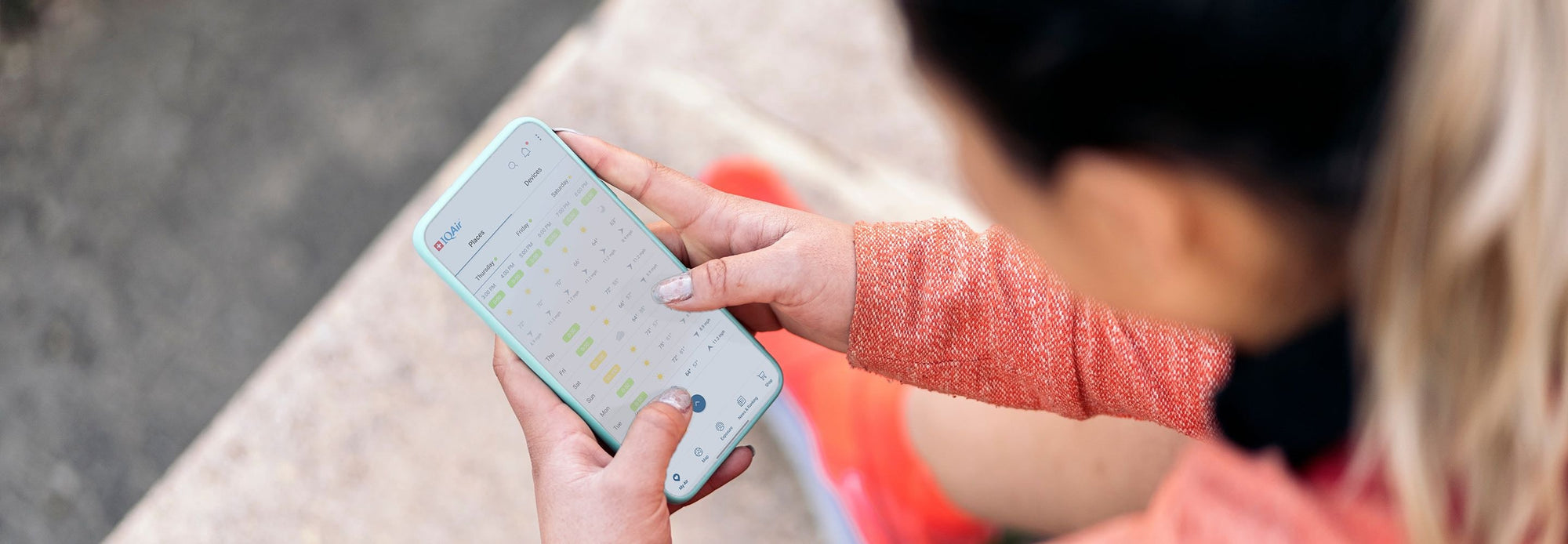 Woman checking air quality on phone