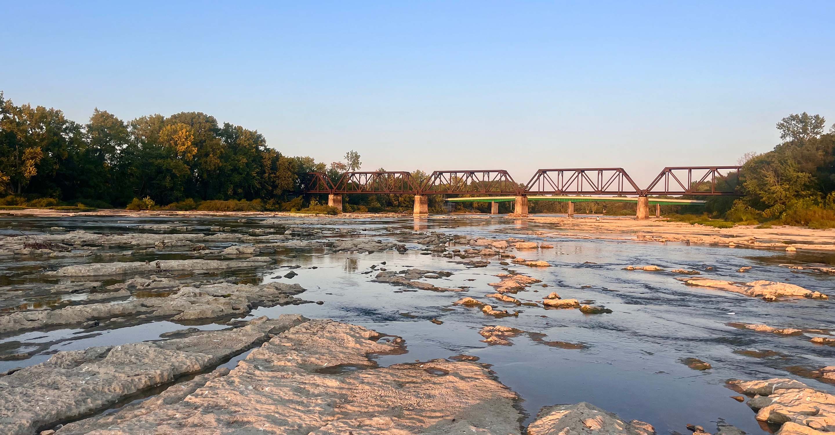 Drying riverbed near a bridge