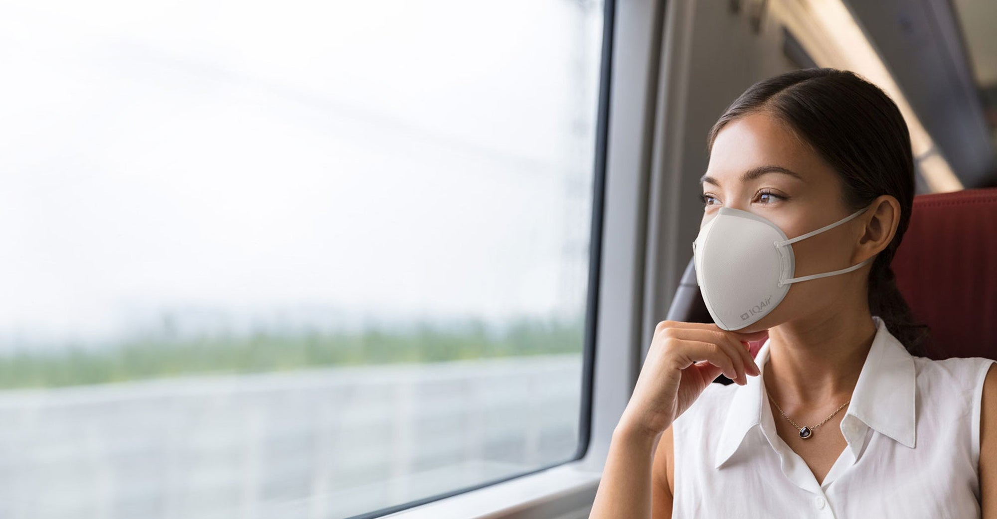 Woman wearing IQAir Mask traveling