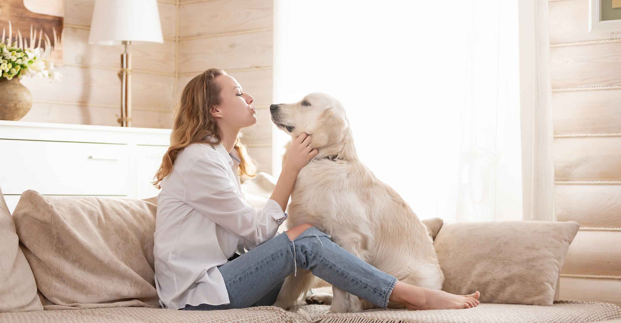 Woman with dog on couch