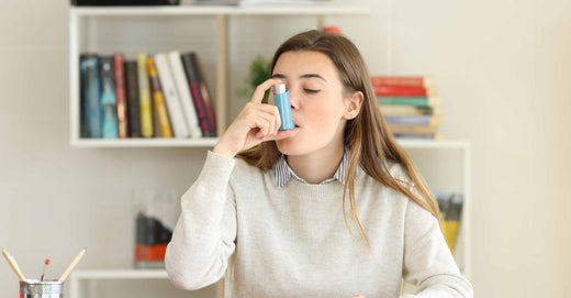 woman holding inhaler