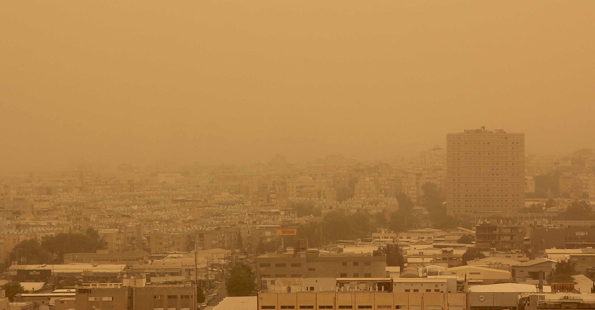 A cloud of dust over a city.