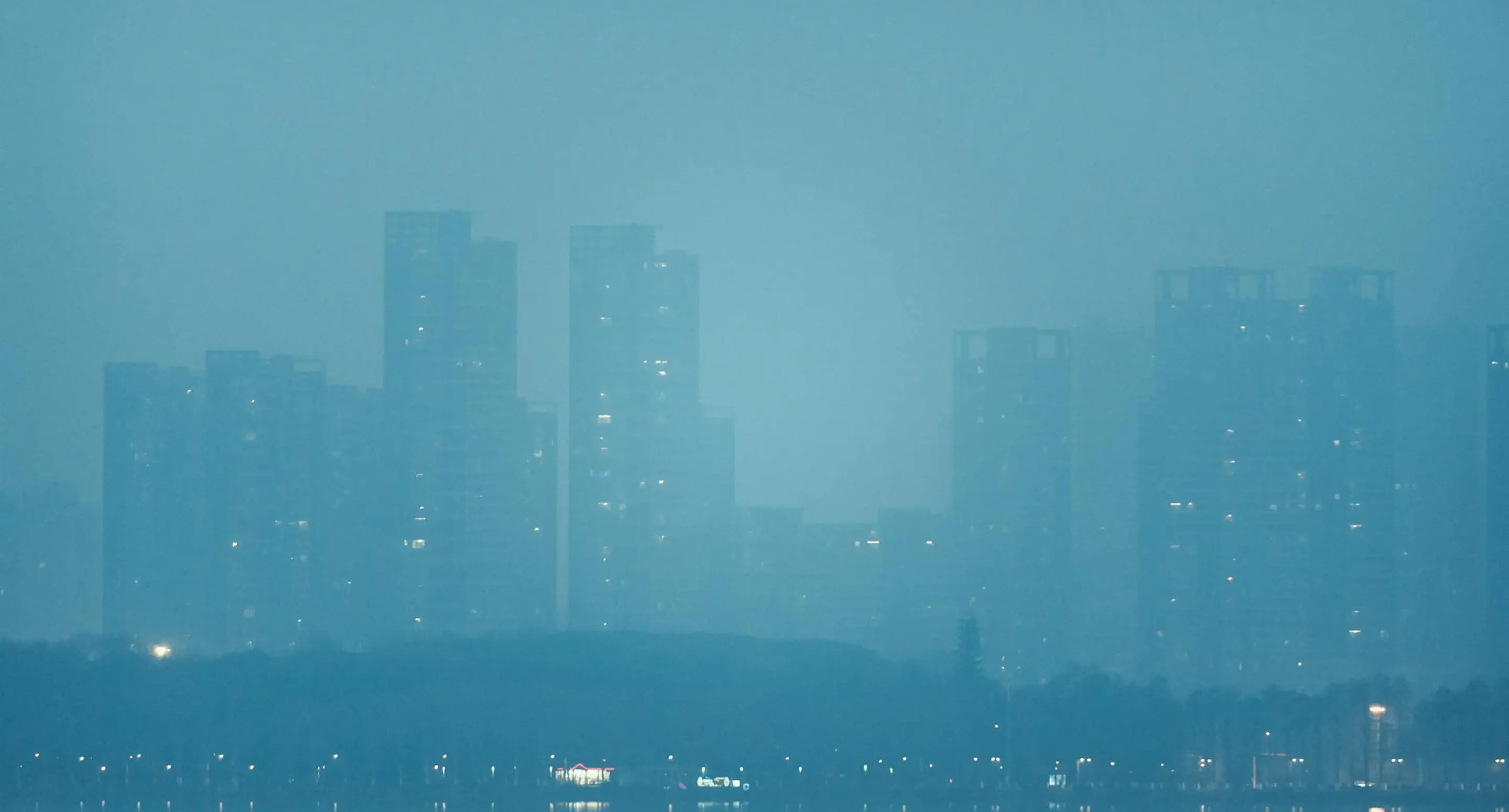 Hazy skies over city landscape