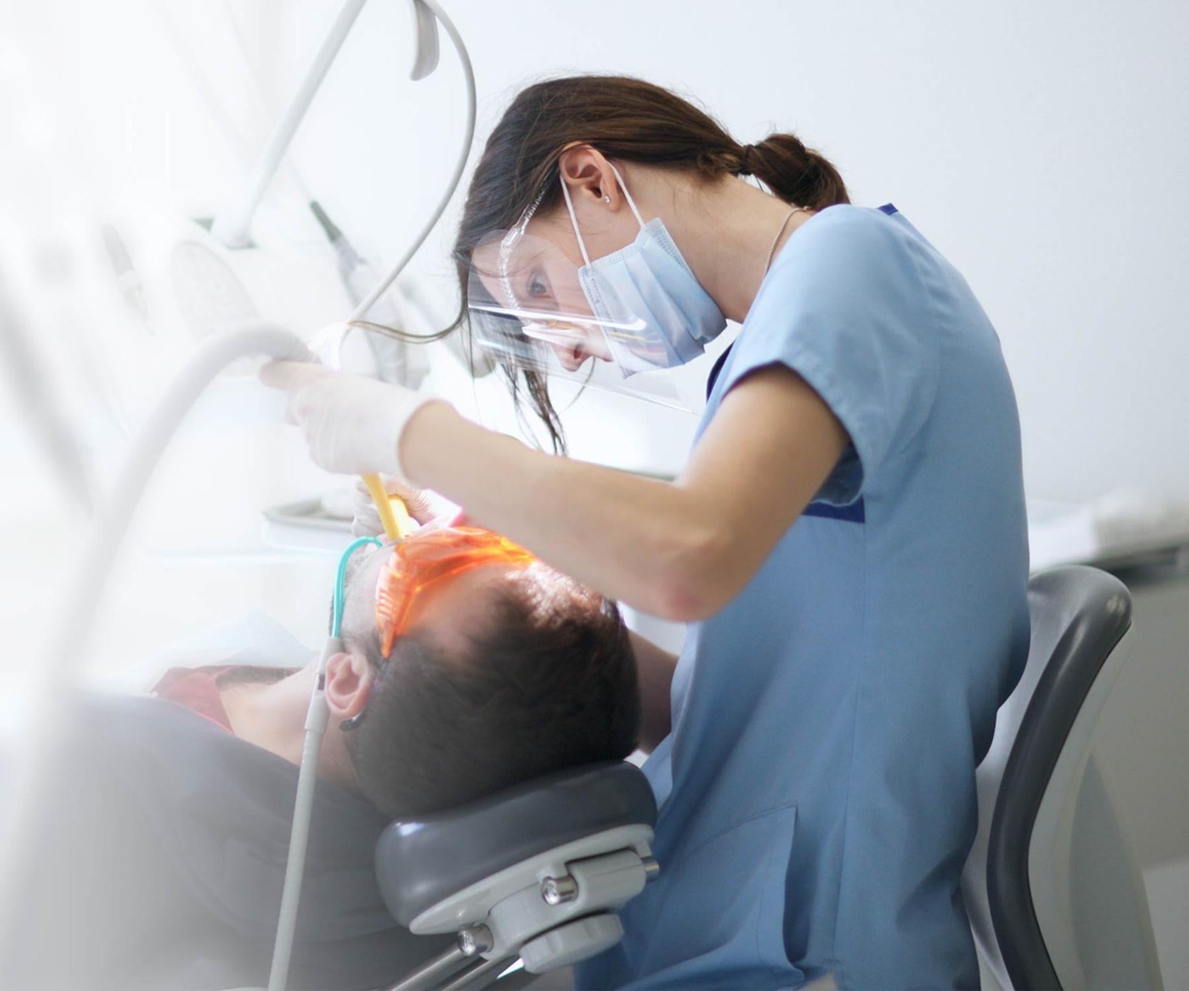 Dentist working on patient